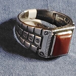 MASCULINE CARNELIAN, STERLING RING. IN A ABSTRACT, ALMOST MECHANIC, MOTIF. SZ-12